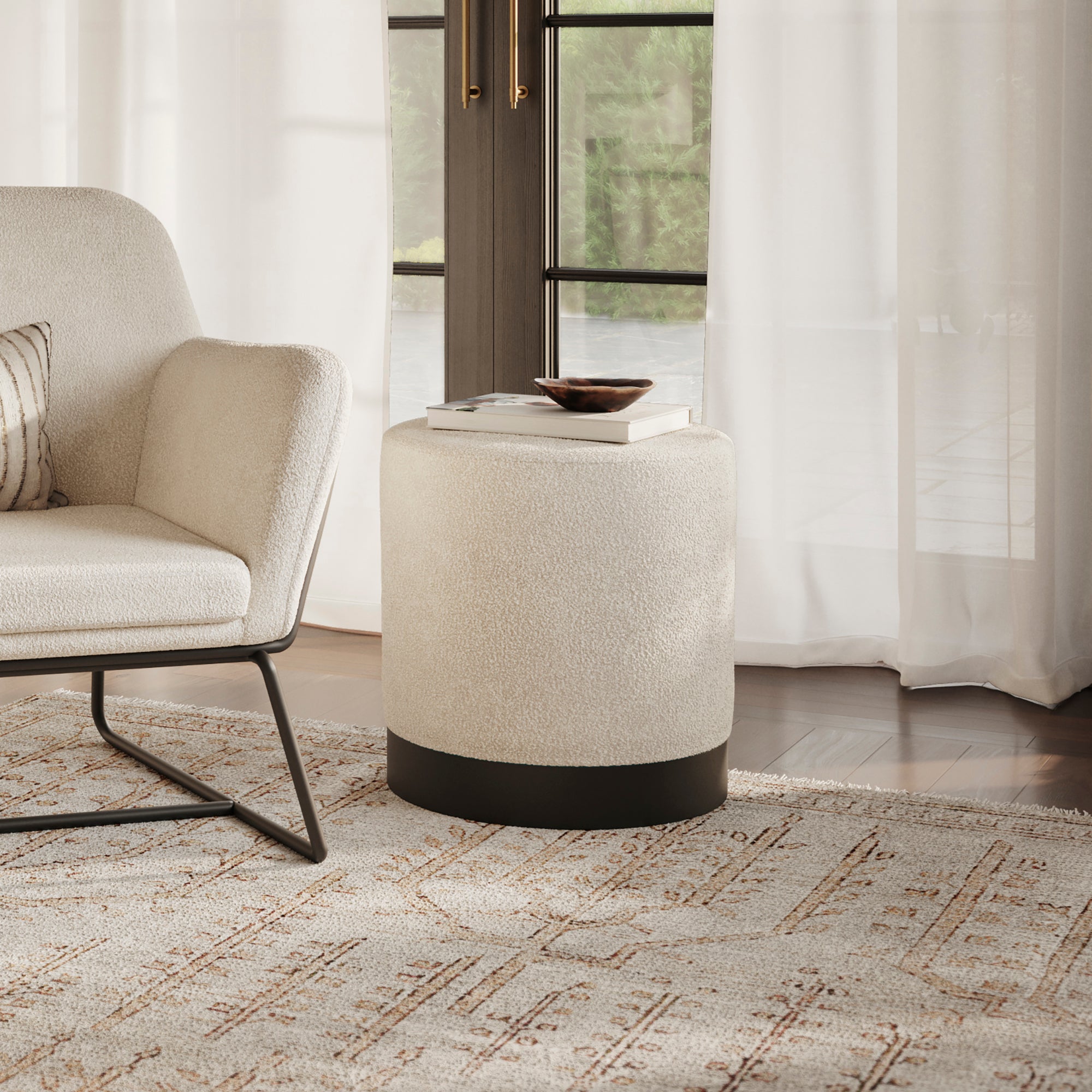 Small round ivory boucle stool with matte black base