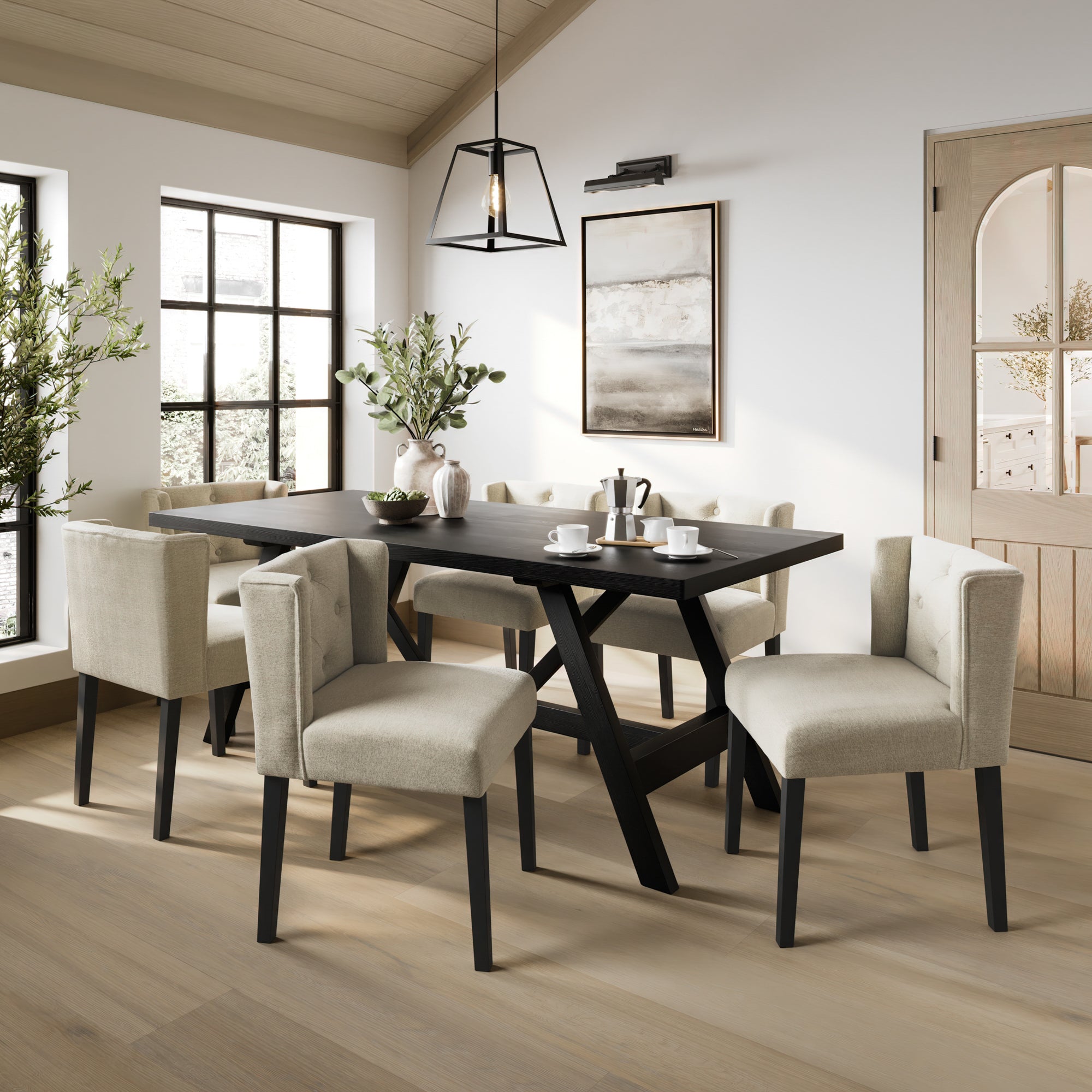 Black dining table with beige linen dining chairs