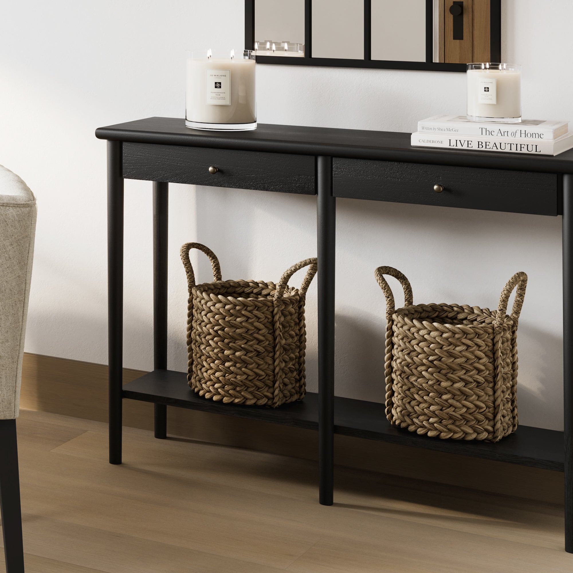 Black console table with two drawers and an open shelf 