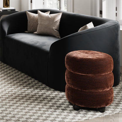 Brown velvet pouffe with matte black legs