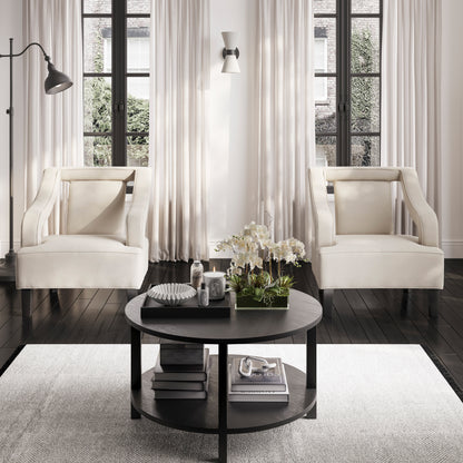 Modern beige soft armchair with matte black legs in a modern living room