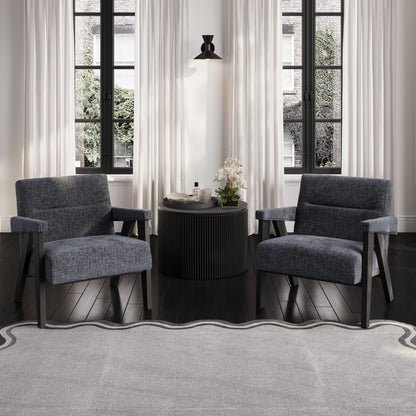 Grey velvet armchair with black wooden legs with small black round table