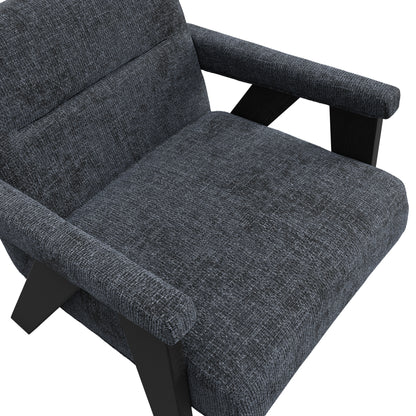 Grey velvet armchair with black wooden legs