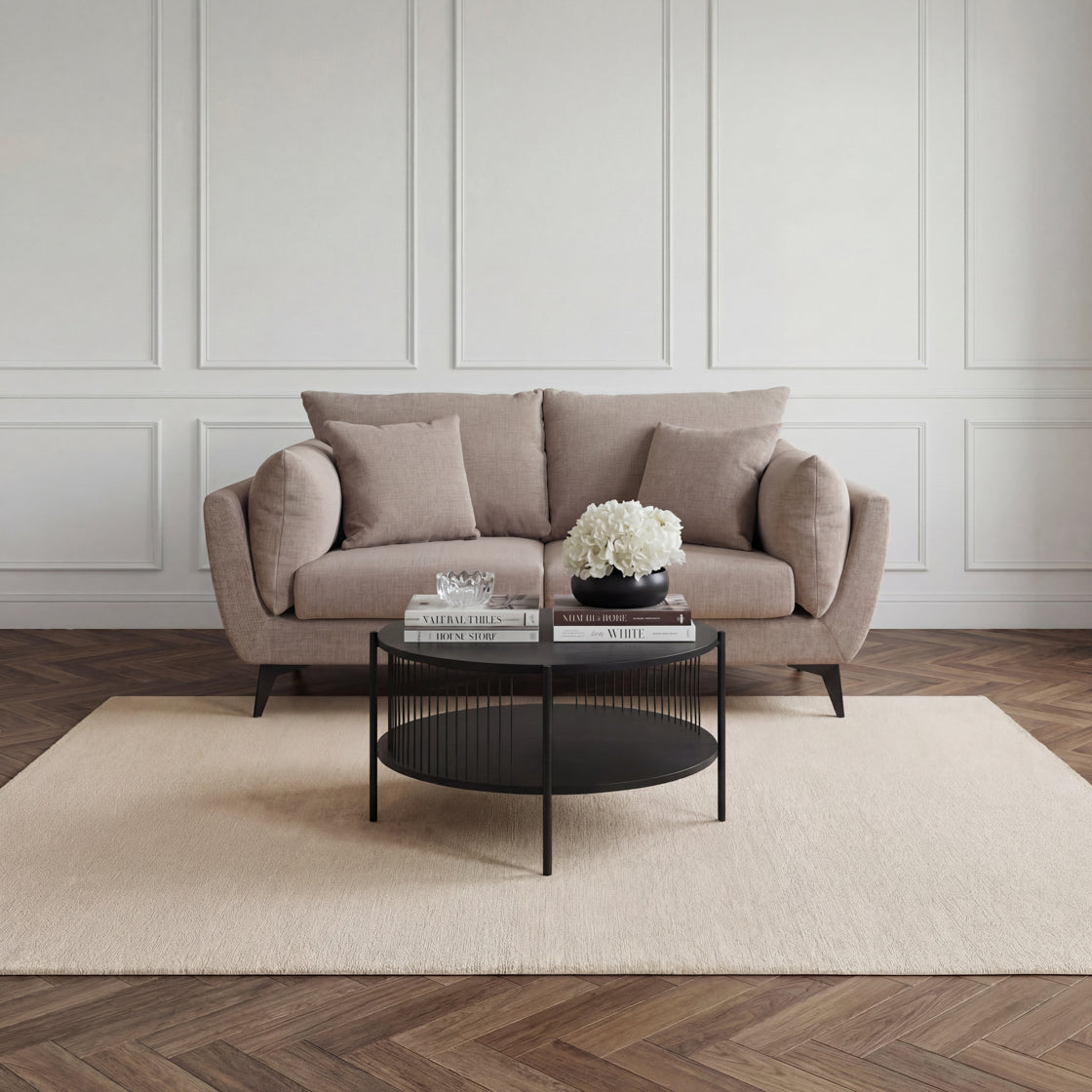 Beige Chenille 3 seater sofa with black metal legs in a neutral coloured living room