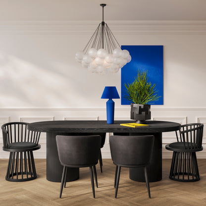 Modern Long round black dining table with black dining chairs