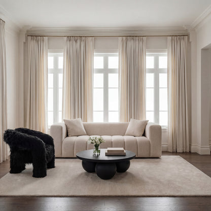 Beige 3 seater Chenille Sofa in a neutral living room