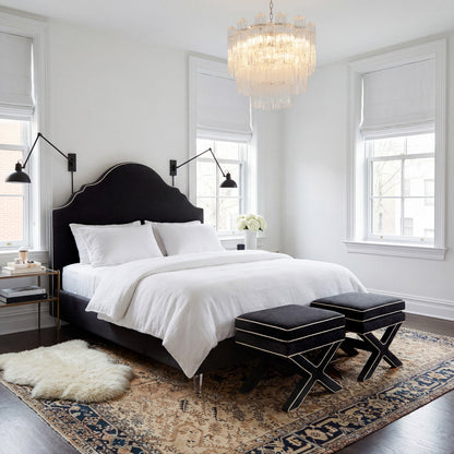 two Black Velvet X shaped Stools in a neutral coloured bedroom