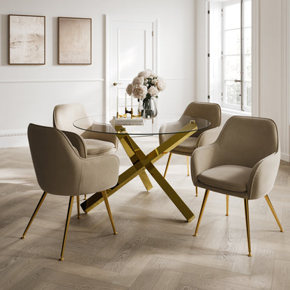 Modern dining room with a glass table and beige dining chairs